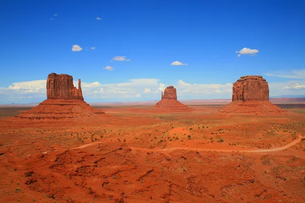 Red sandstone buttes of Monument Valley under a blue sky, Arizona, USA